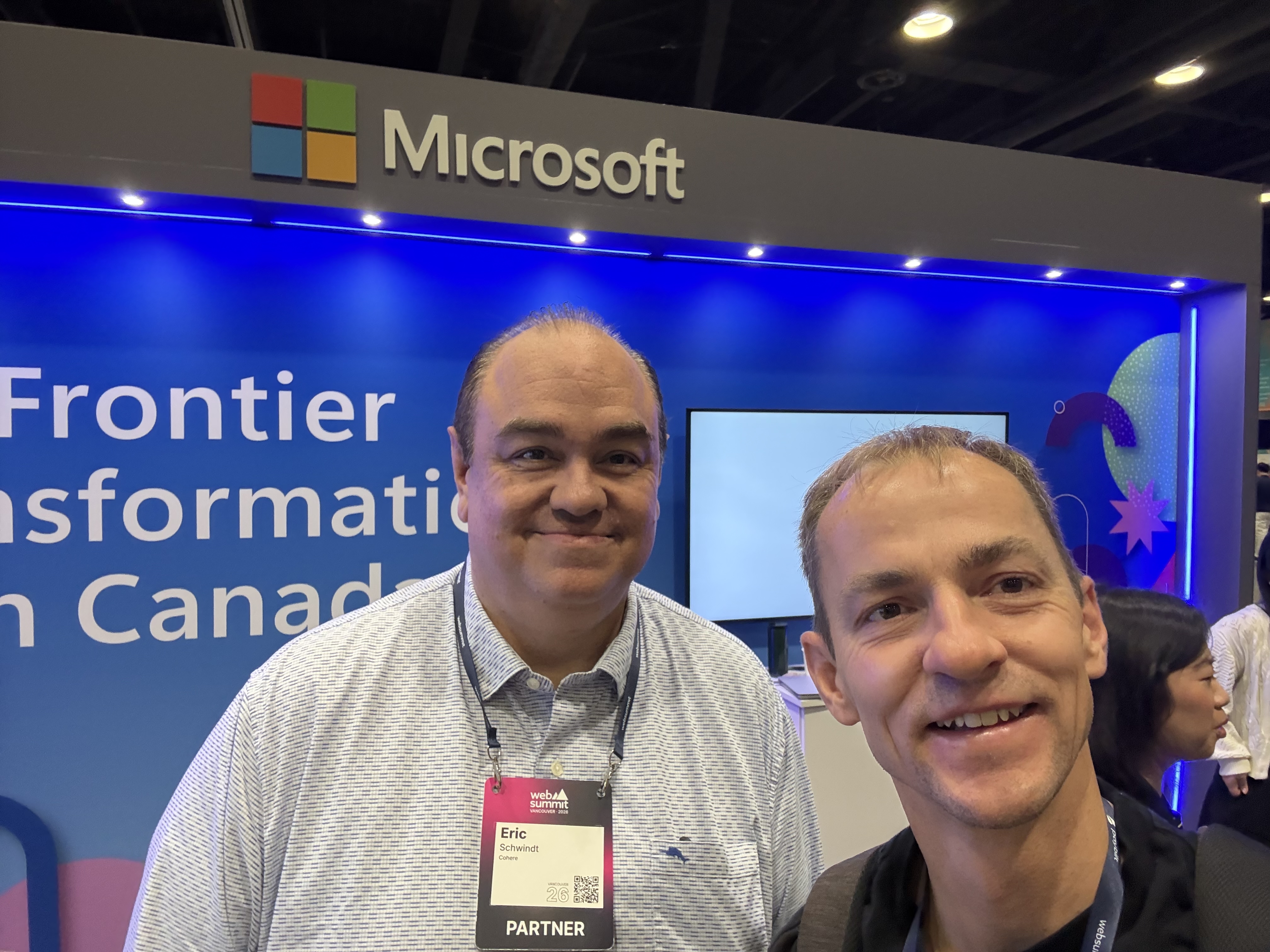 Jonathan Parsons with Eric Schwindt from Cohere at the Microsoft stand during Web Summit Vancouver