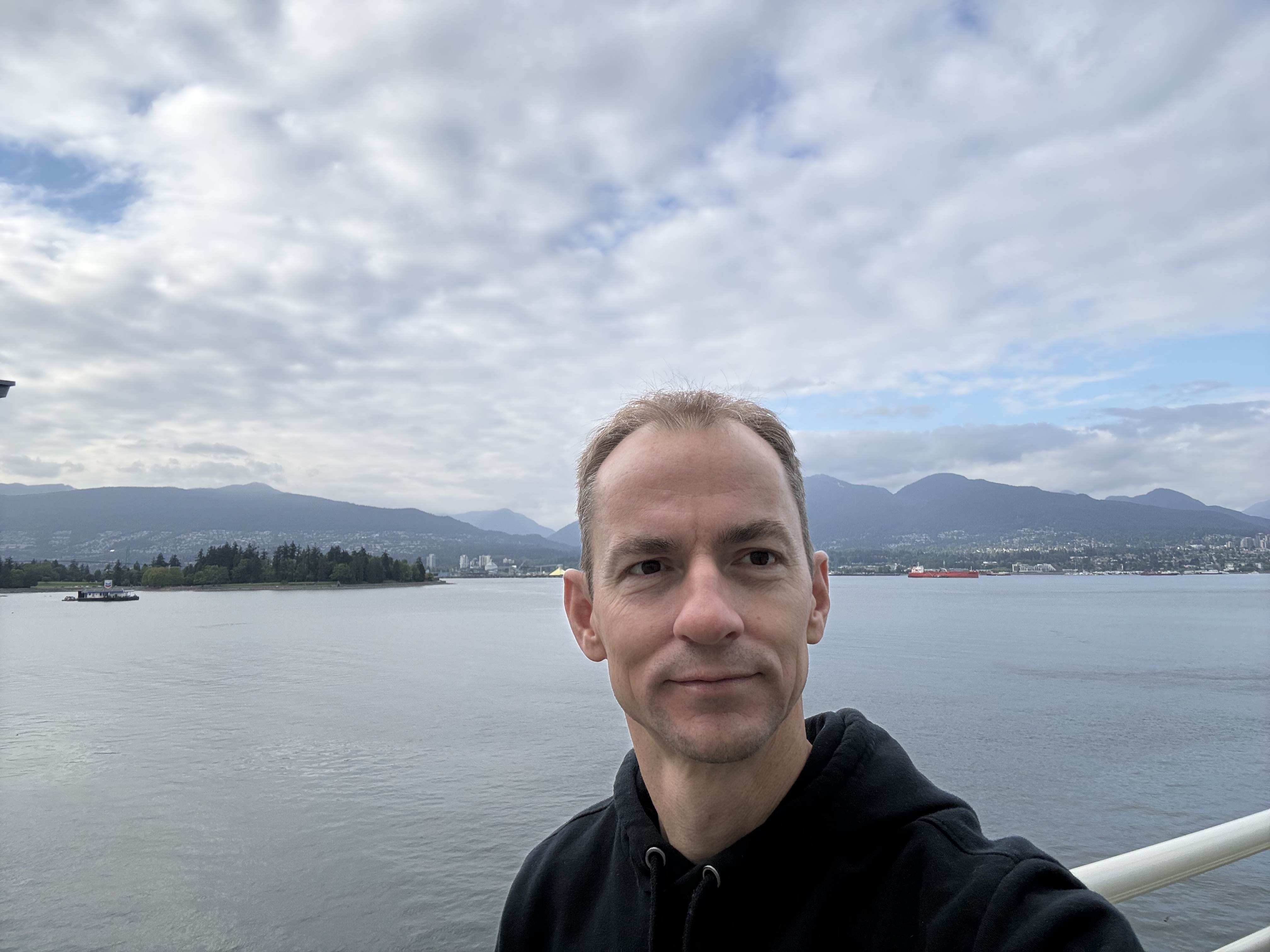 Jonathan Parsons in Vancouver with the harbour and mountains in the background